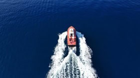 A boat navigating through open water, showcasing advanced marine application technology.