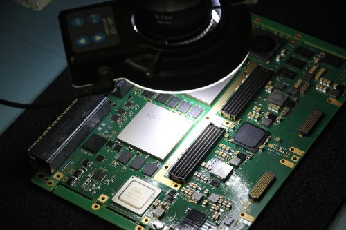 Electronic circuit board with testing equipment and sensors.